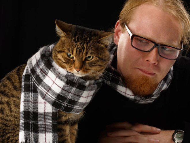 Posing with a cat in matching scarfs. Beautiful.