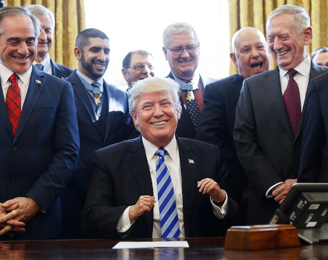 Trump is happy despite his tiny hands.