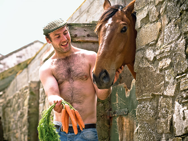 Irish farmer posing with his horse.