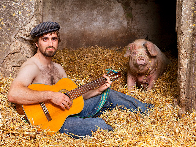Irish farmer playing love ballade to his girlfriend.