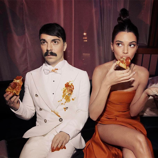 Kendall Jenner and Kirby eating pizza.