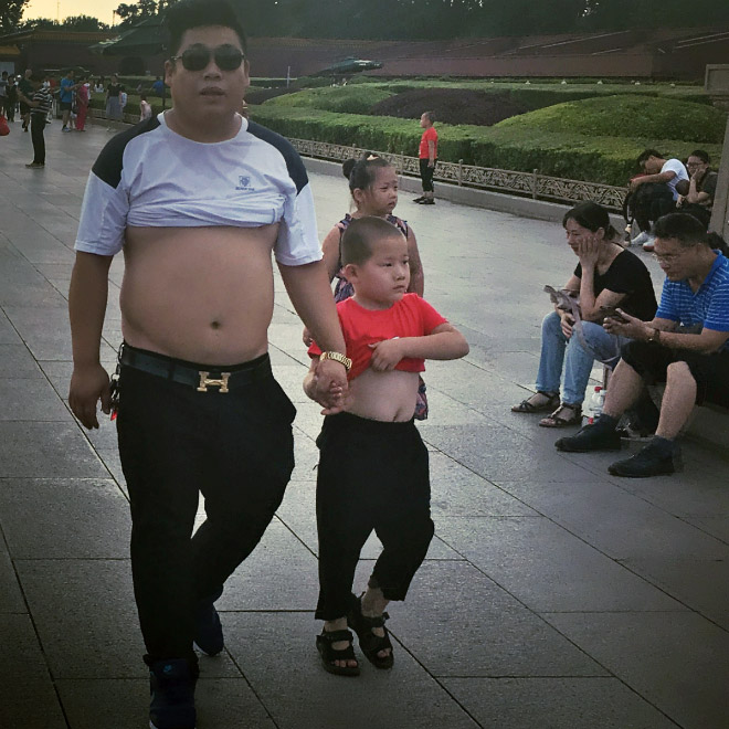 Father and son wearing a Beijing bikini.