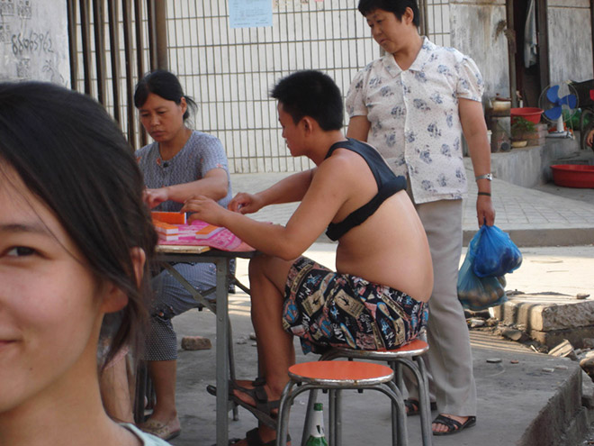 Guy wearing a Beijing bikini.